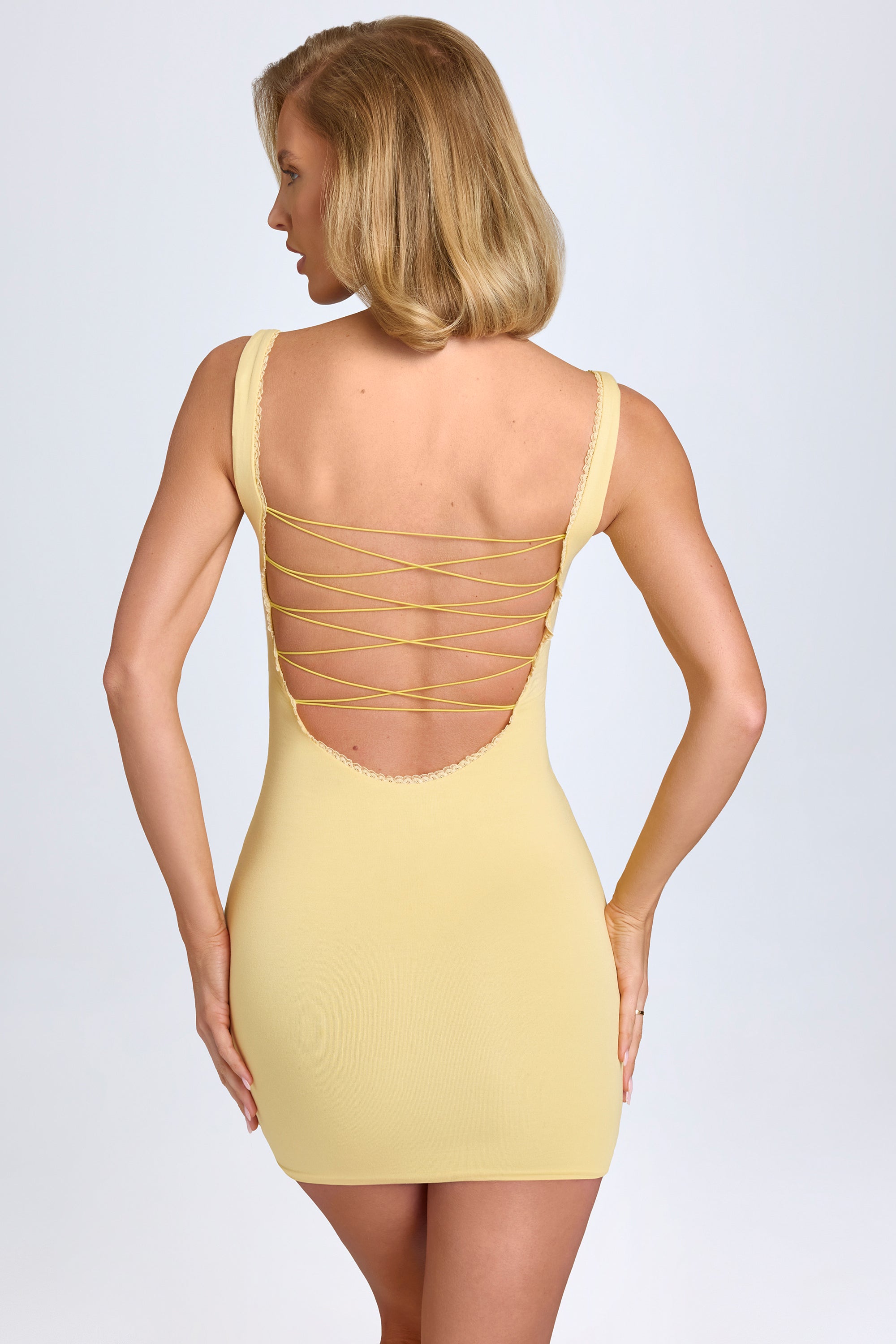Aoife Modal Lace-Trim Bodycon Mini Dress in Pastel Yellow | Oh Polly Aoife Modal Lace-Trim Bodycon Mini Dress in Pastel Yellow | Oh Polly