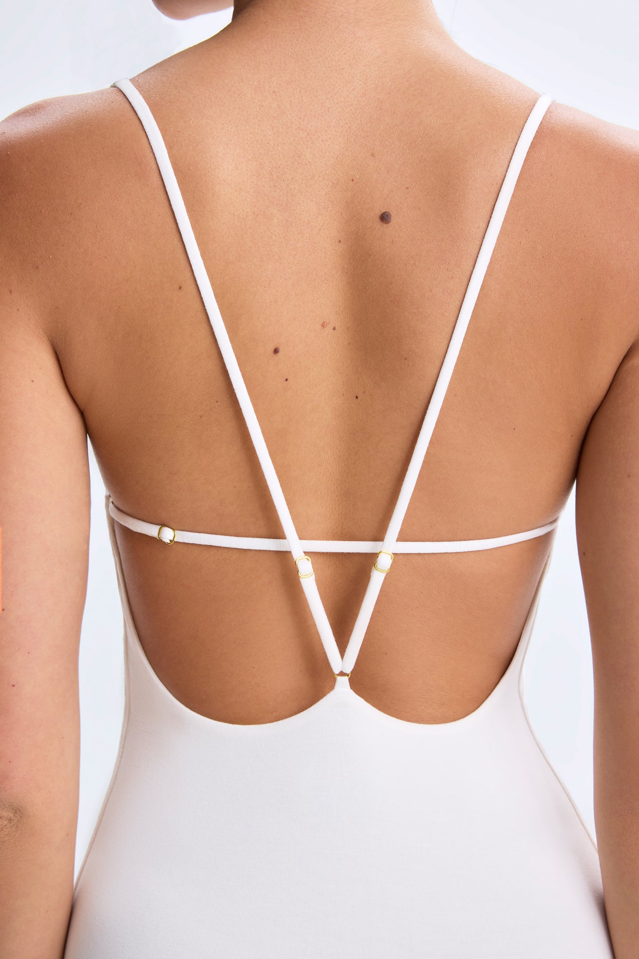 Petite Plunge Open-Back Flared Jumpsuit in White