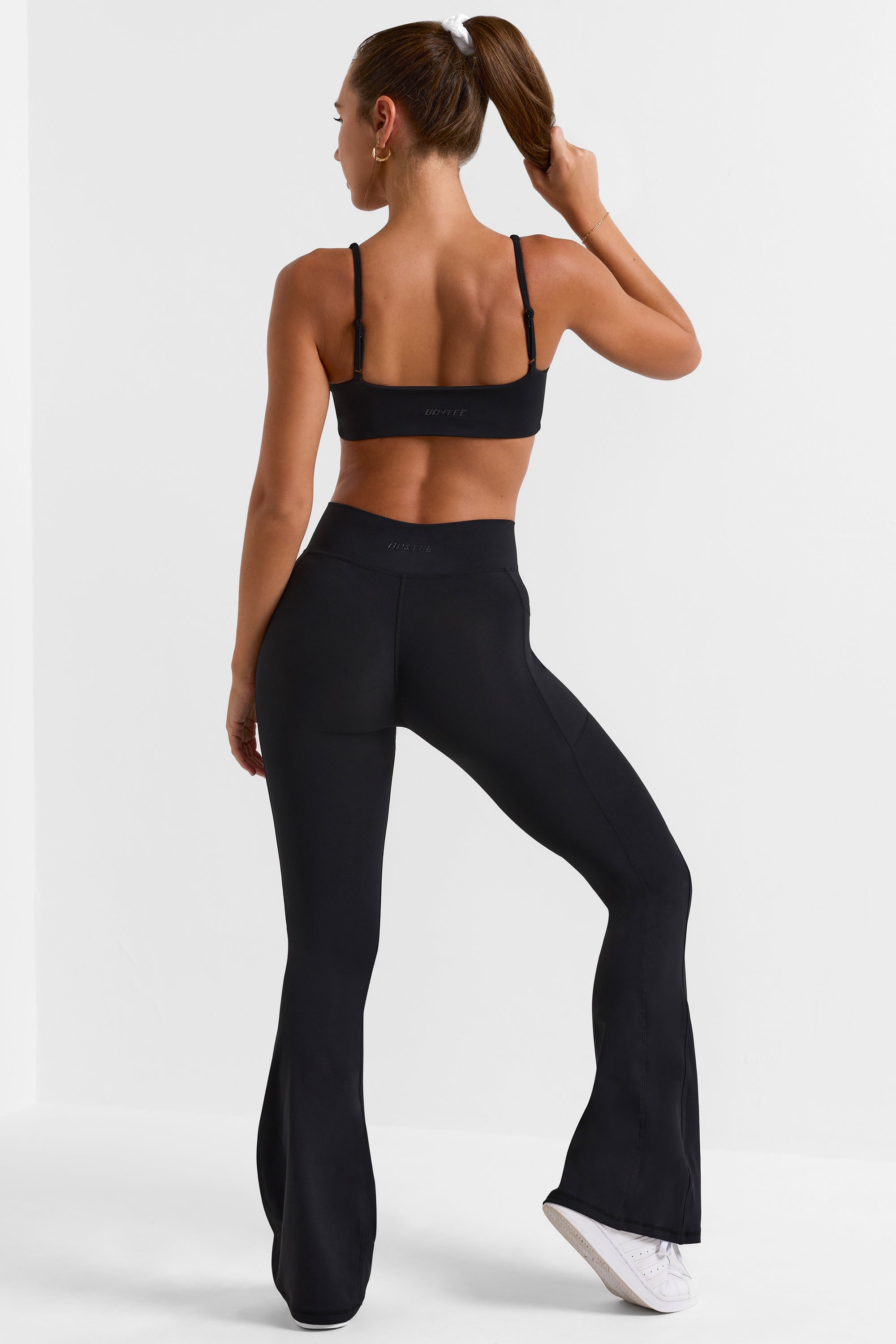 Match Cross Waistband Flare Pocket Leggings in Black Oh Polly