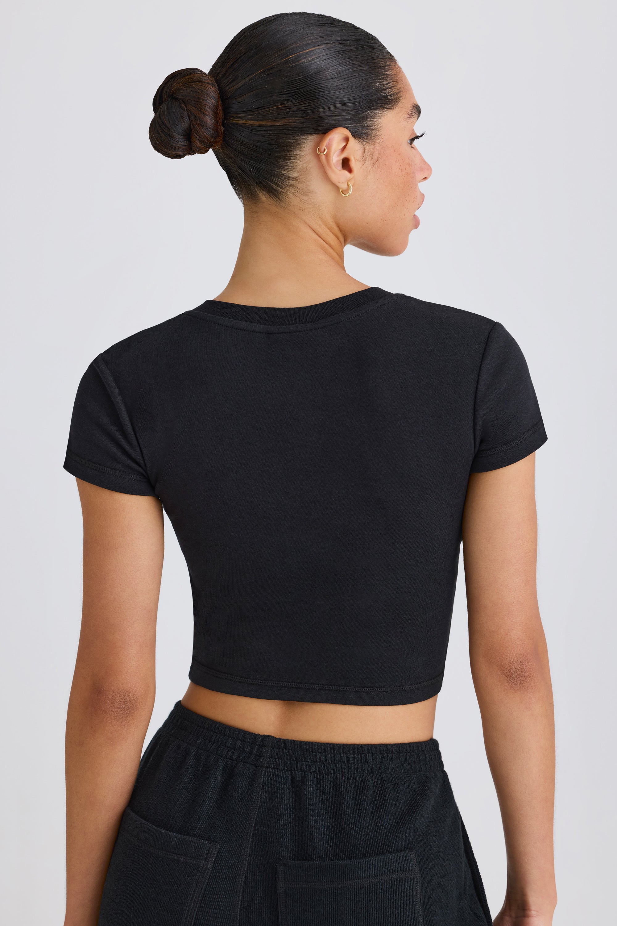 Jet Set Graphic-Print Cropped T-Shirt in Black | Oh Polly