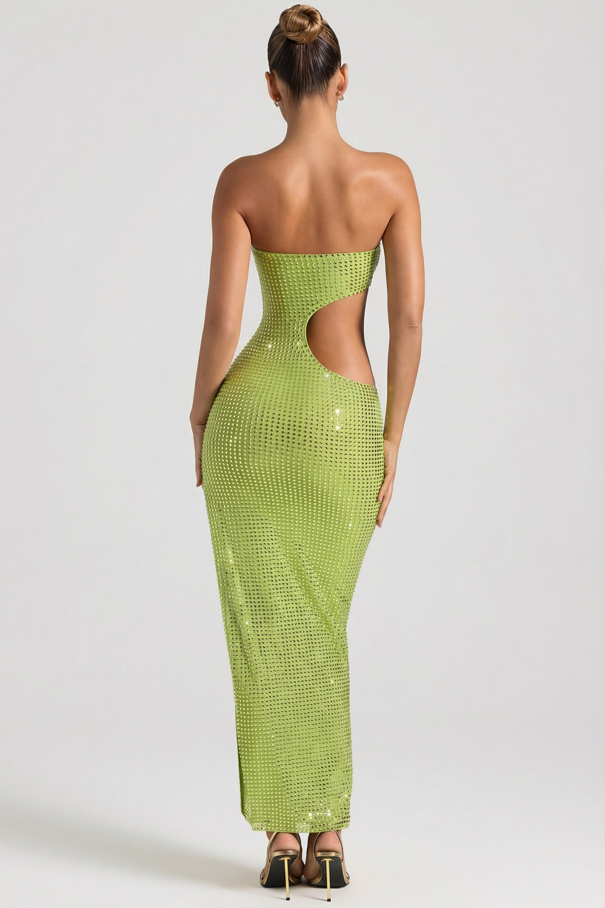 emerald green bandeau folded detail extreme split maxi dress Restocked + ready to shine. Our best-selling strapless accordion pleat is back in greenand she brings the DRAMA. The perfect wedding guest or holiday moment waiting to happen. this maxi dress ensures a graceful movement Luannie Halter Scarf Tie Maxi