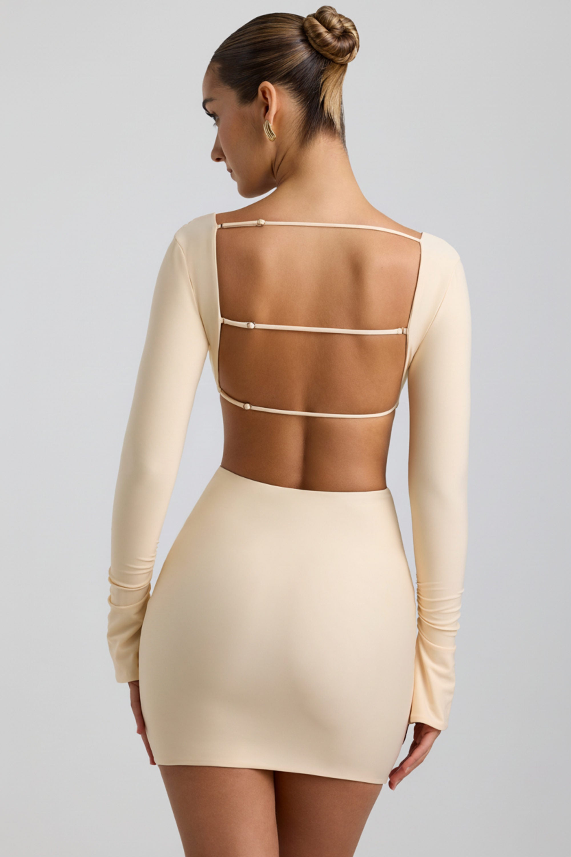 cut-out hardware detail mini dress in buttercream Wyetta Cut-Out Hardware Detail Mini Dress in Buttercream