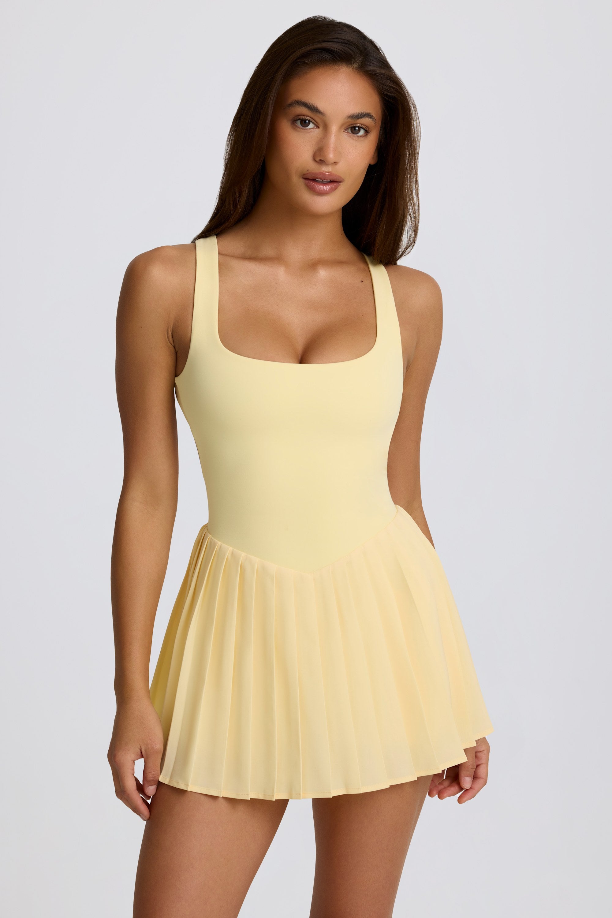 Soft Active Open-Back Pleated Tennis Dress in Lemon Oh Polly