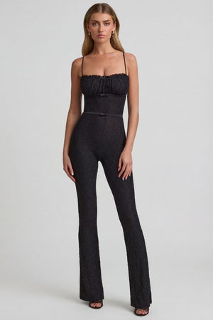 Oh Polly's Freya Tidy wearing the Arlena Regular Jumpsuit in Black Stretch Lace fabric perfect for special occasions