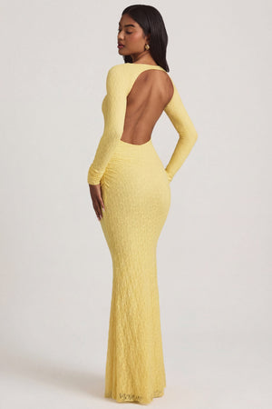 Oh Polly's Yarelis wearing the Tarini Maxi Dress in Pastel Yellow Stretch Lace fabric perfect for spring weddings
