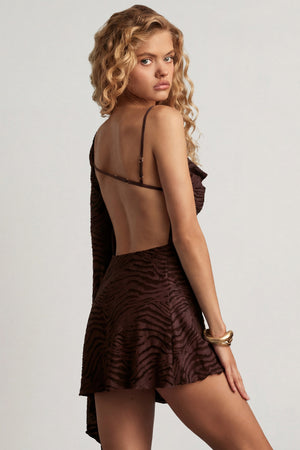 Oh Polly's Juliana Nulu wearing the Angelie Mini Dress in Dark Chocolate Burn Out Jersey fabric perfect for cocktail parties