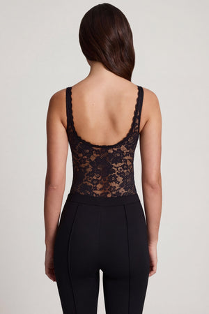 Oh Polly's Roberta wearing the Zayla Bodysuit in Black Stretch Lace fabric perfect for date night style