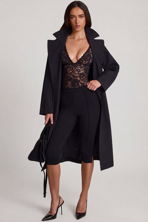 Oh Polly's Roberta wearing the Zayla Bodysuit in Black Stretch Lace fabric perfect for cocktail events