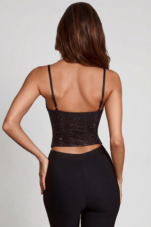 Oh Polly's Yasmin wearing the Armelia Full Top in Black Hotfix Square Hotfix fabric, perfect for a night out