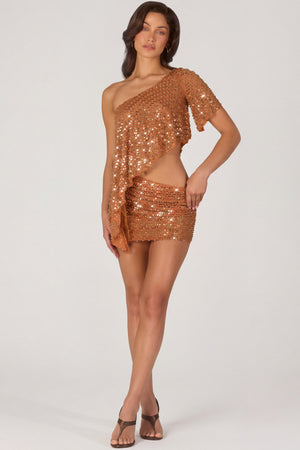 Oh Polly's Michelle Ivana wearing the Cassiana Mini Skirt in Bronze fabric perfect for a night out