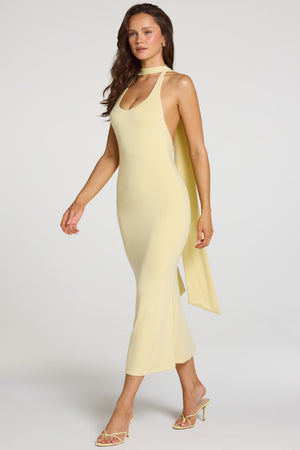 Oh Polly model Georgia wearing the Giselle Maxi Dress in Pastel Yellow Modal fabric perfect for sunset strolls