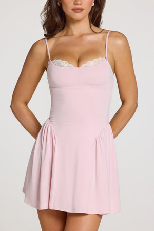 Oh Polly model Georgia wearing the Delphine Mini Dress in Baby Pink Modal fabric perfect for summer garden parties
