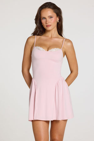 Oh Polly model Georgia wearing the Delphine Mini Dress in Baby Pink Modal fabric perfect for brunch with friends