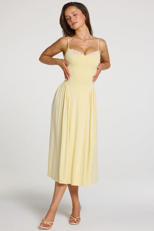 Oh Polly model Georgia wearing the Livia Midaxi Dress in Pastel Yellow Modal fabric perfect for spring weddings