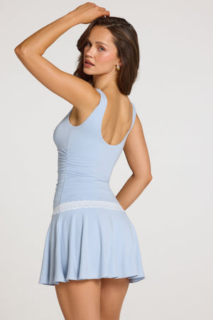 Oh Polly model Georgia wearing the Maia Mini Dress in Light Blue Modal fabric perfect for birthday celebrations out