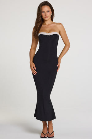 Oh Polly model Georgia wearing the Winslet Midaxi Dress in Black Modal fabric perfect for evening events