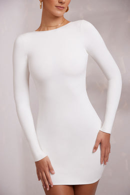 Mini-robe dos nu à manches longues en blanc