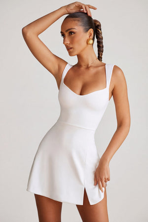 Oh Polly's Priscilla wearing the Jolie Mini Dress in White Modal fabric perfect for summer garden parties