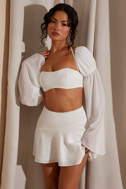 Rozkloszowana spódnica mini z panelami w kolorze białym
