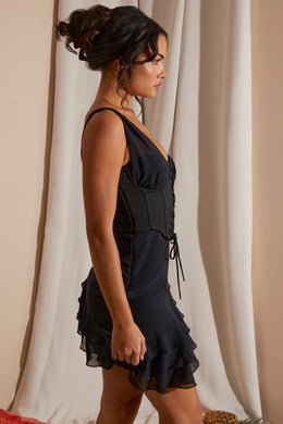 Asymetryczna sukienka mini z gorsetem i falbanką w kolorze czarnym