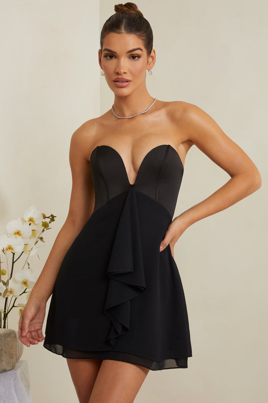 Mini-robe corset sans bretelles à décolleté plongeant en noir