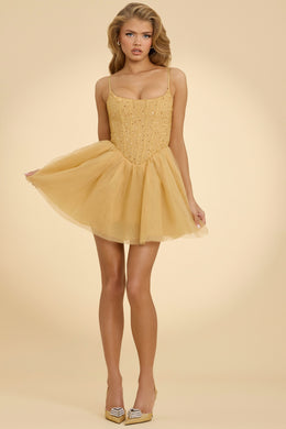 Mini-robe avec jupe corset en tulle ornée, dorée