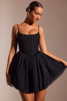 Ozdobiona gorsetowa mini sukienka z tiulową spódnicą w kolorze czarnym