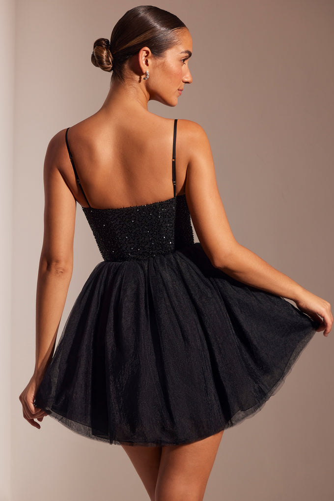 Ozdobiona gorsetowa mini sukienka z tiulową spódnicą w kolorze czarnym