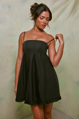 Czarna sukienka mini z podwyższonym stanem, bawełniana o linii A