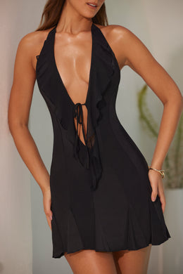 Sukienka mini o linii A z dekoltem typu halter i falbanką w kolorze czarnym