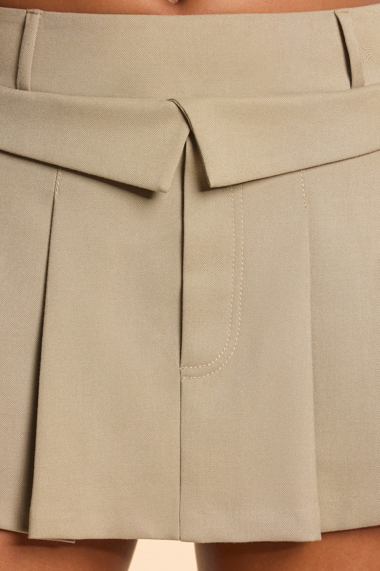 Brushed Twill Mid Rise Pleated Micro Mini Skirt in Taupe