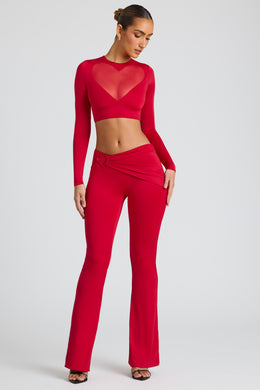 Spodnie z prostymi nogawkami i drapowanymi detalami w kolorze ognistej czerwieni