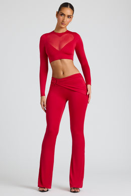 Spodnie z prostymi nogawkami i drapowanymi detalami w kolorze ognistej czerwieni
