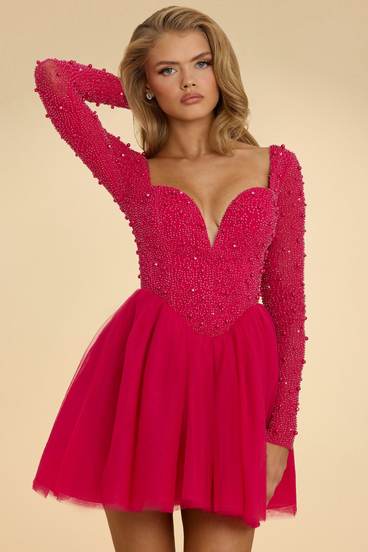 Mini-robe en tulle à col plongeant en rose vif