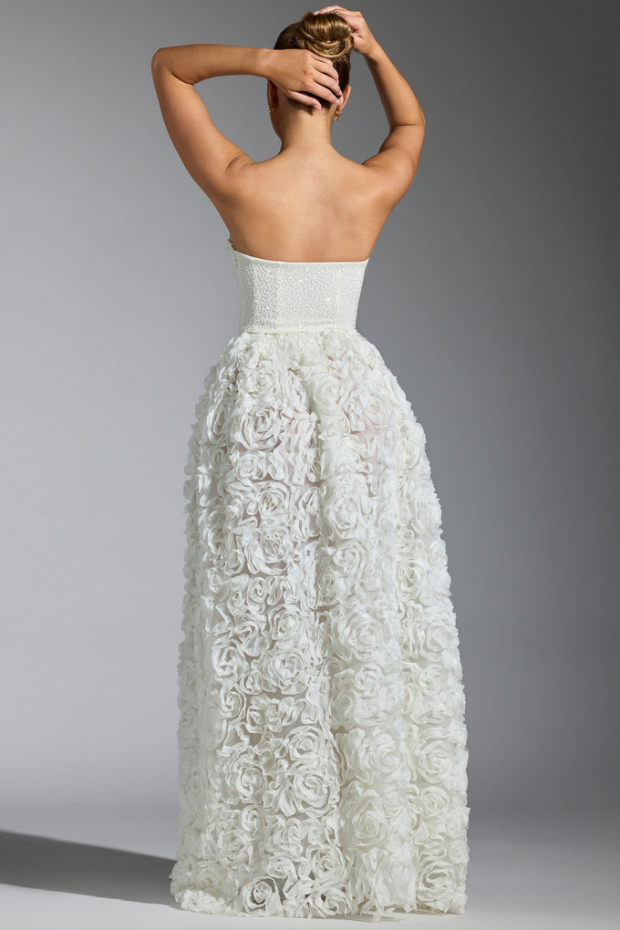 Biała suknia z gorsetem ze zdobionymi kwiatowymi aplikacjami