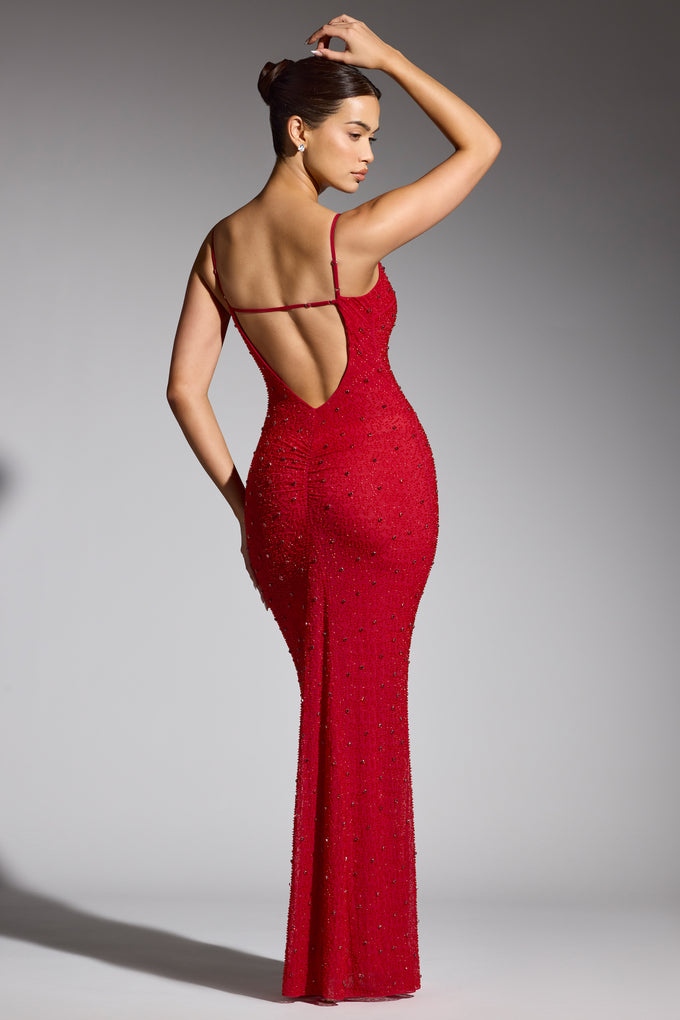 Ozdobiona suknia wieczorowa z głębokim dekoltem w kolorze czerwonym