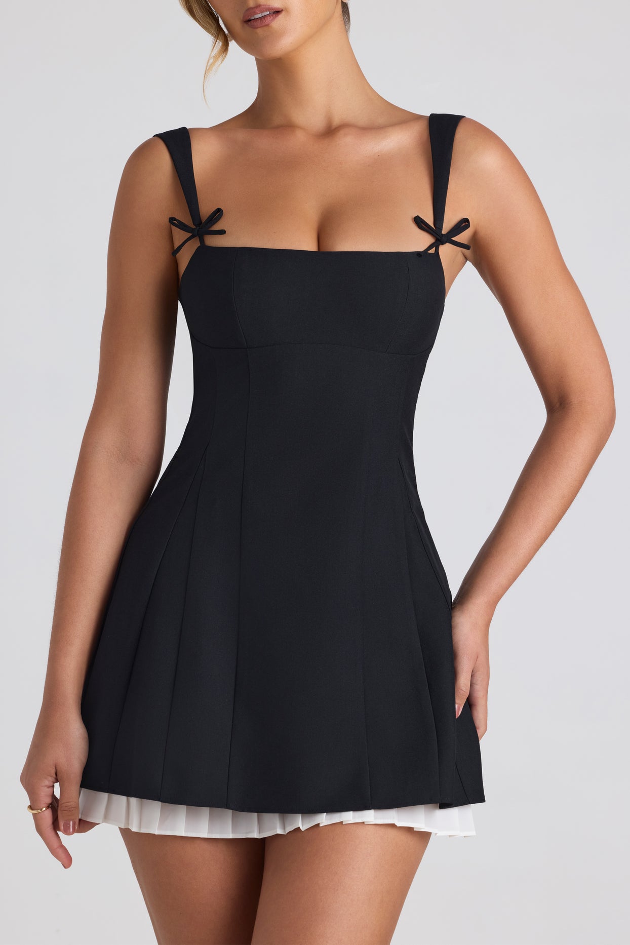 Bow-Embellished Pleated A-Line Mini Dress in Black