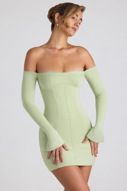 Mini sukienka Godet z długim rękawem i odkrytymi ramionami w kolorze wiosennej zieleni