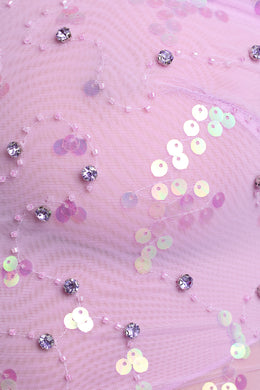 Asymetryczny top z marszczonymi falbankami w kolorze fioletowo-różowym
