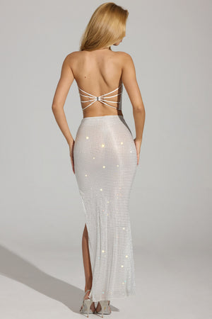 Oh Polly model Priscilla wearing the Pelagia Maxi Skirt in White Square Hotfix fabric perfect for holiday resort dinners