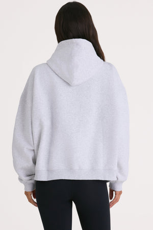 Bo+Tee model Kiele wearing the Varsity Hoodie in Marl Grey Cotton fabric perfect for casual outings