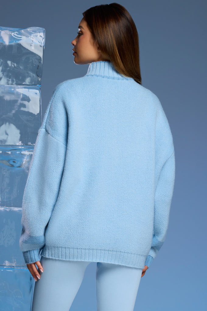 Oversize'owy sweter z grubej dzianiny zapinany na zamek w kolorze Baby Blue