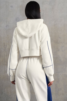 Veste courte à capuche zippée doublée gaufrée en blanc