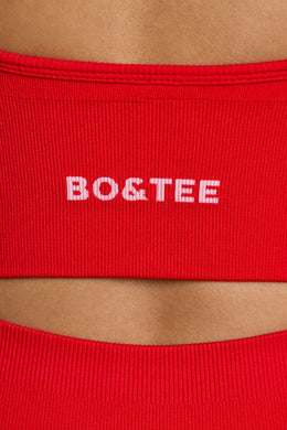 Biustonosz sportowy Define Luxe z dekoltem w kształcie litery V w kolorze czerwonym