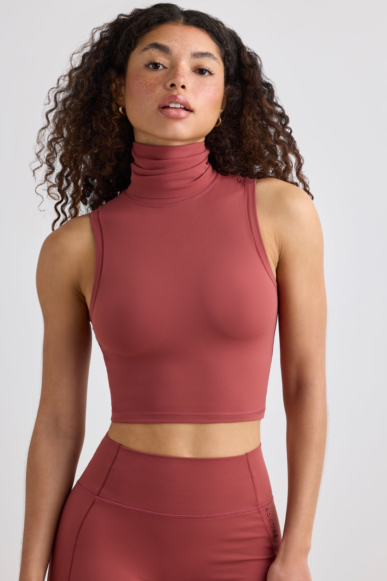 Soft Active Turtleneck Tank Top in Rust | Oh Polly