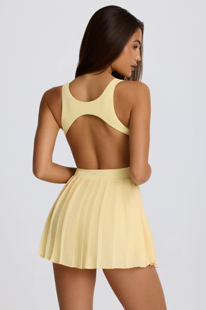 Soft Active Open-Back Pleated Tennis Dress in Lemon