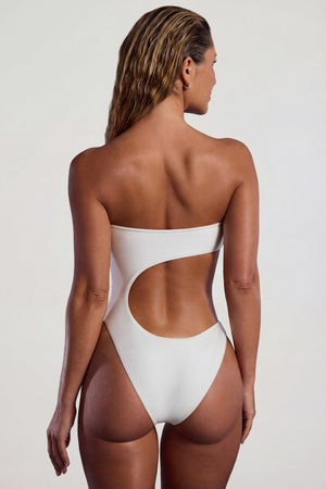 Oh Polly Swim's Sierra Skye wearing the Tulum Swimsuit in Ivory fabric perfect for beach vacations