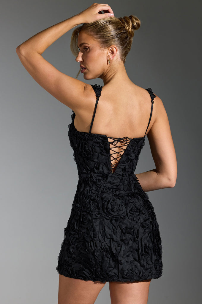Gorsetowa mini sukienka z kwiatowymi aplikacjami w kolorze czarnym