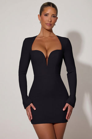 Oh Polly's Sierra Skye wearing the Adelia Mini Dress in Black Crepe fabric perfect for evening events