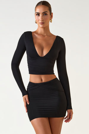 Oh Polly's Priscilla wearing the Aliz Mini Skirt in Black Modal fabric perfect for date night style